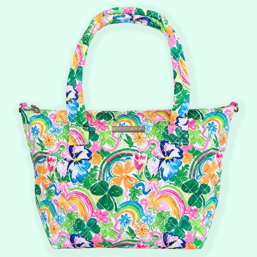 A colorful quilted medium satchel handbag with a floral pattern in various colors including pink, green, blue, and yellow.