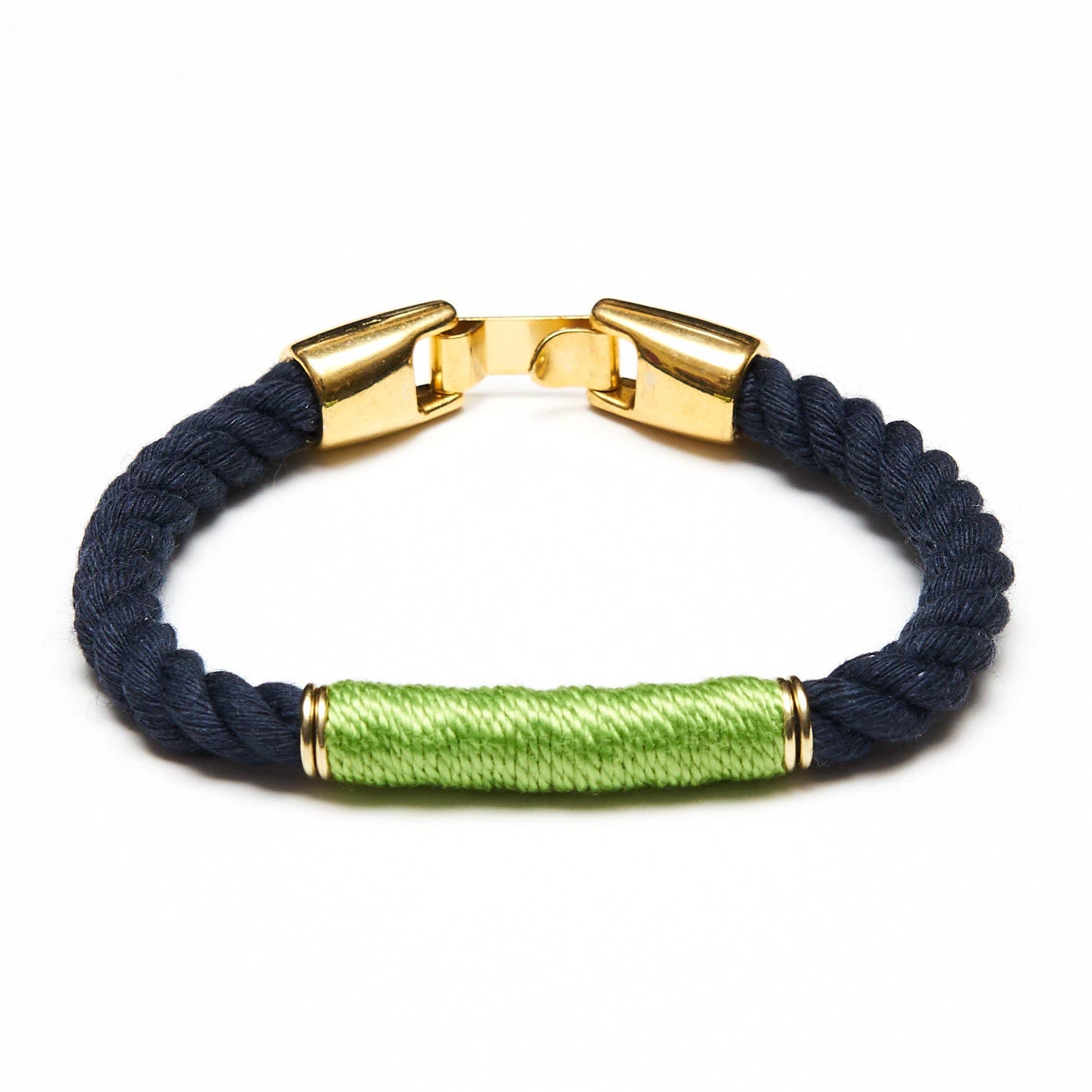 Navy blue braided bracelet with gold clasp and green accent on a white background