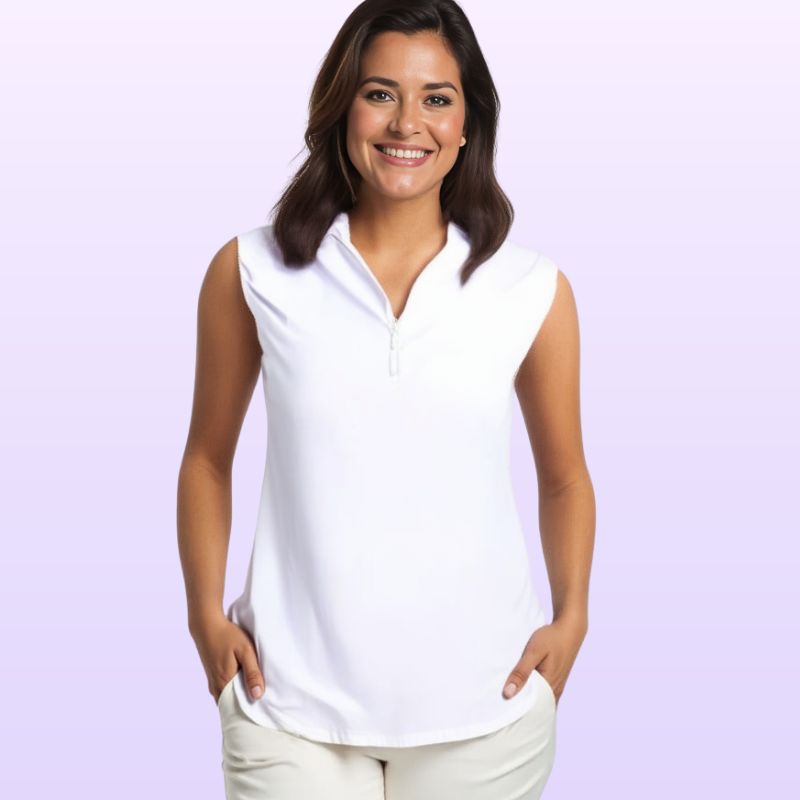 A woman wearing a white sleeveless top with a zip-up collar, paired with light-colored pants.